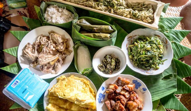 Trying local food in Nong Khiaw