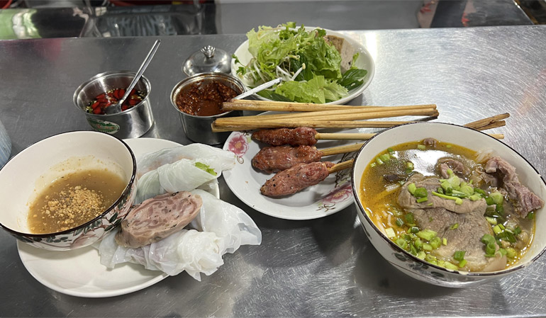 Nem Lui (Grilled Pork Skewers) and Bun Bo Hue (beef noodle soup)